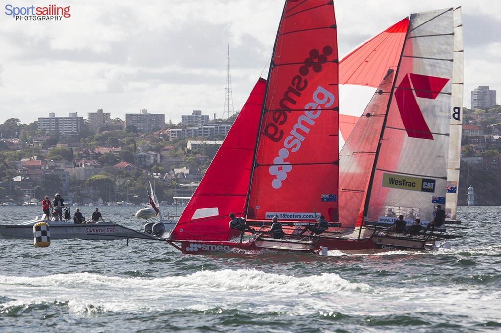 Smeg edging towards 3rd place with Thurlow Fisher and C-tech already finished - its a photo finish on day 4 - 18ft Skiff JJ Giltinan Championships 2013 - Day 4  © Beth Morley - Sport Sailing Photography http://www.sportsailingphotography.com